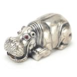 Silver hippopotamus paperweight with ruby eyes, impressed Russian marks, 8cm in length, 71.0g