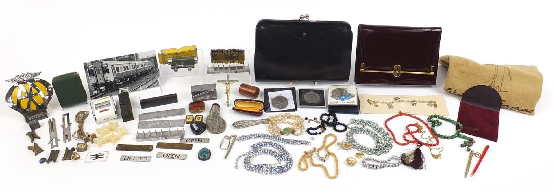 Costume jewellery and sundry items including amber coloured cheroot, ladies clutch bags, AA car