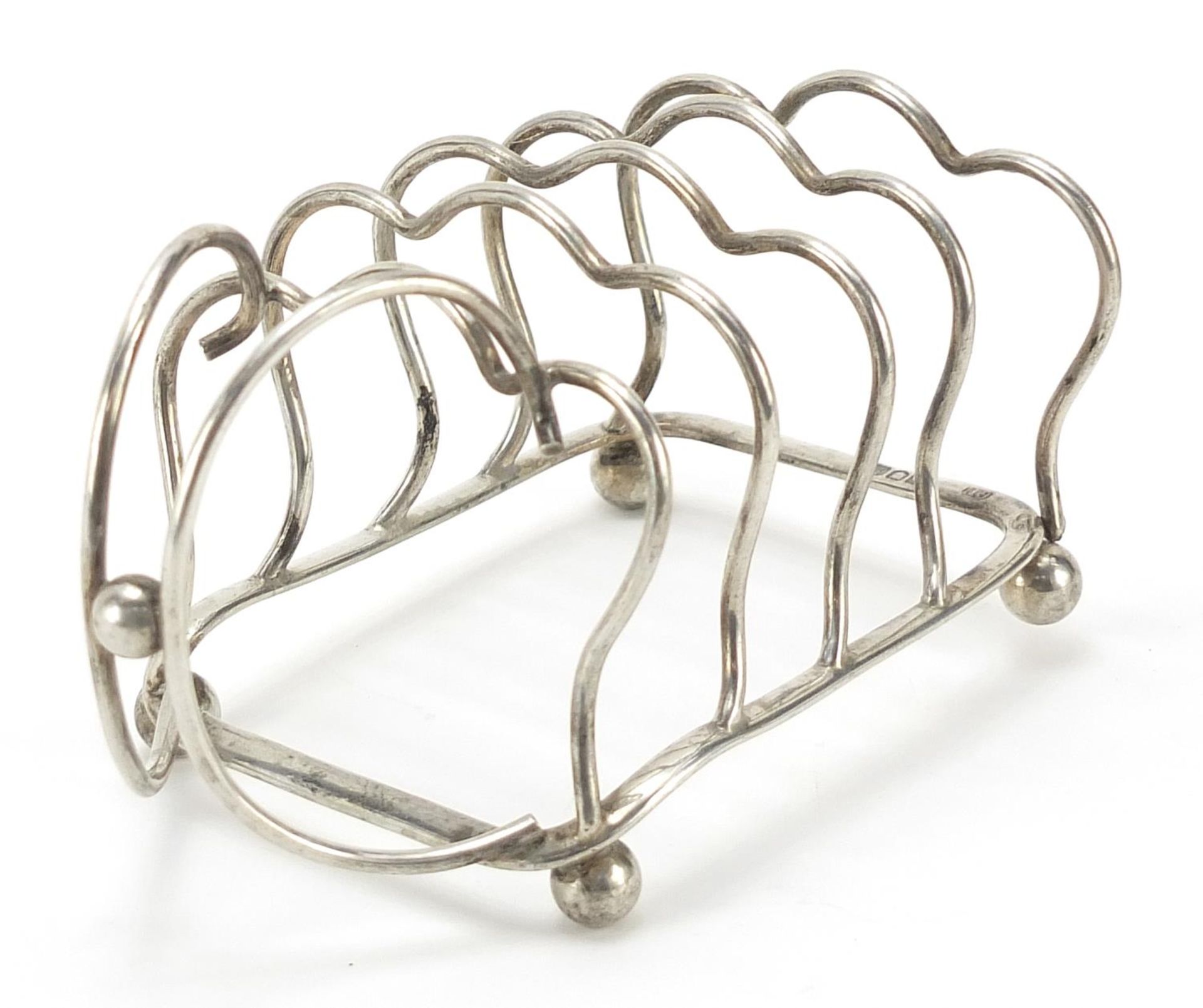 George Unite & Sons, Edward VII silver four slice toast rack with ball feet, London 1904, 12cm in - Image 2 of 4