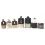 Six antique and later hip flasks, five with leather mounts, the largest 18cm high