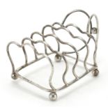 George Unite & Sons, Edward VII silver four slice toast rack with ball feet, London 1904, 12cm in