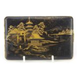 Japanese damascene cigarette case by Fujii Yoshitoyo, engraved with pagodas and a dragon, 12.5cm