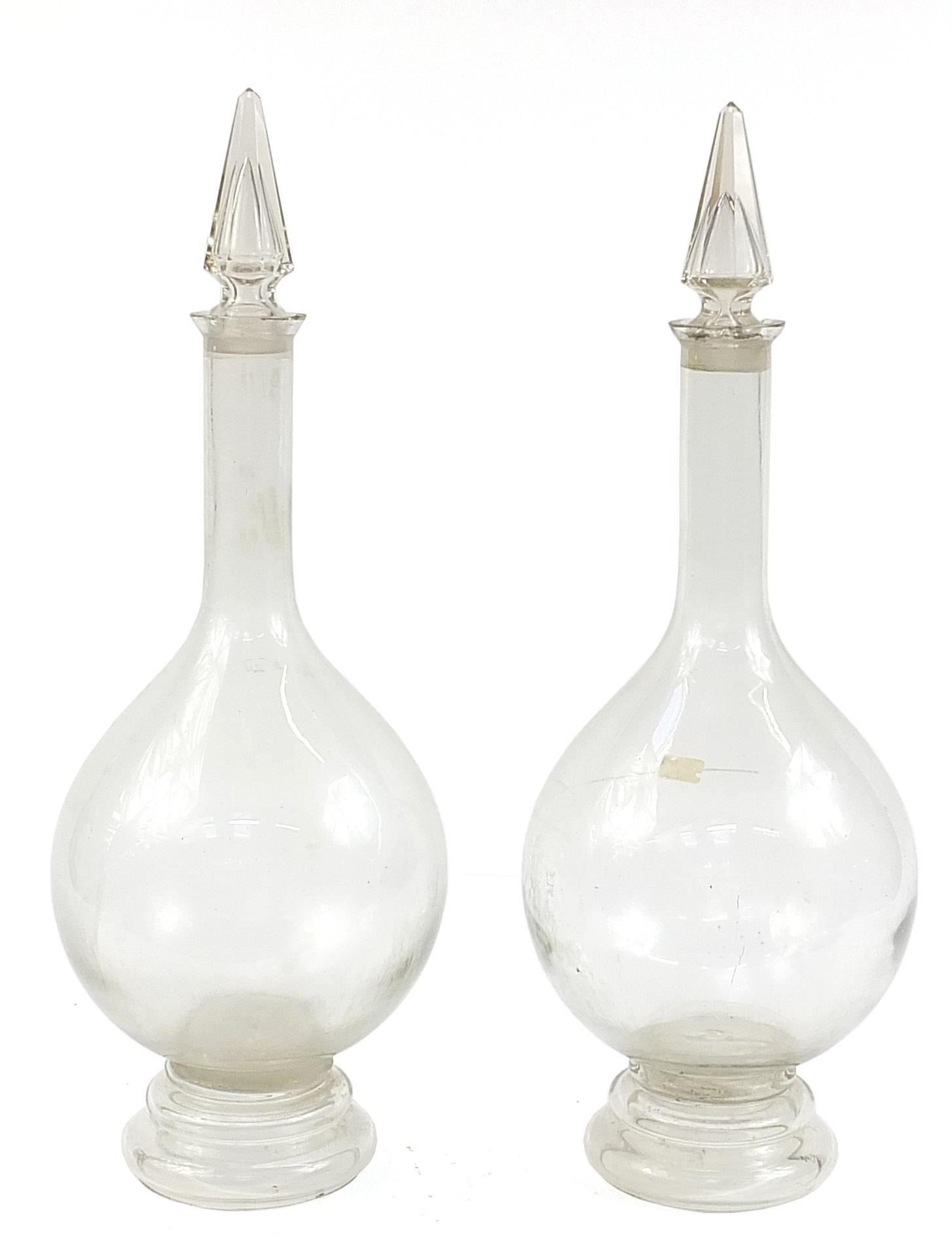 Pair of large 19th century apothecary glass jars with stoppers, each 81cm high