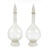 Pair of large 19th century apothecary glass jars with stoppers, each 81cm high