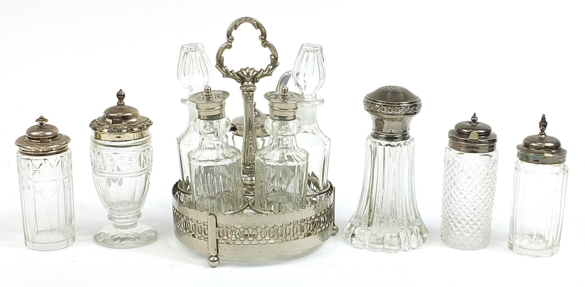 Glass bottle cruets including four Georgian and later with silver lids and a set of five on stand,