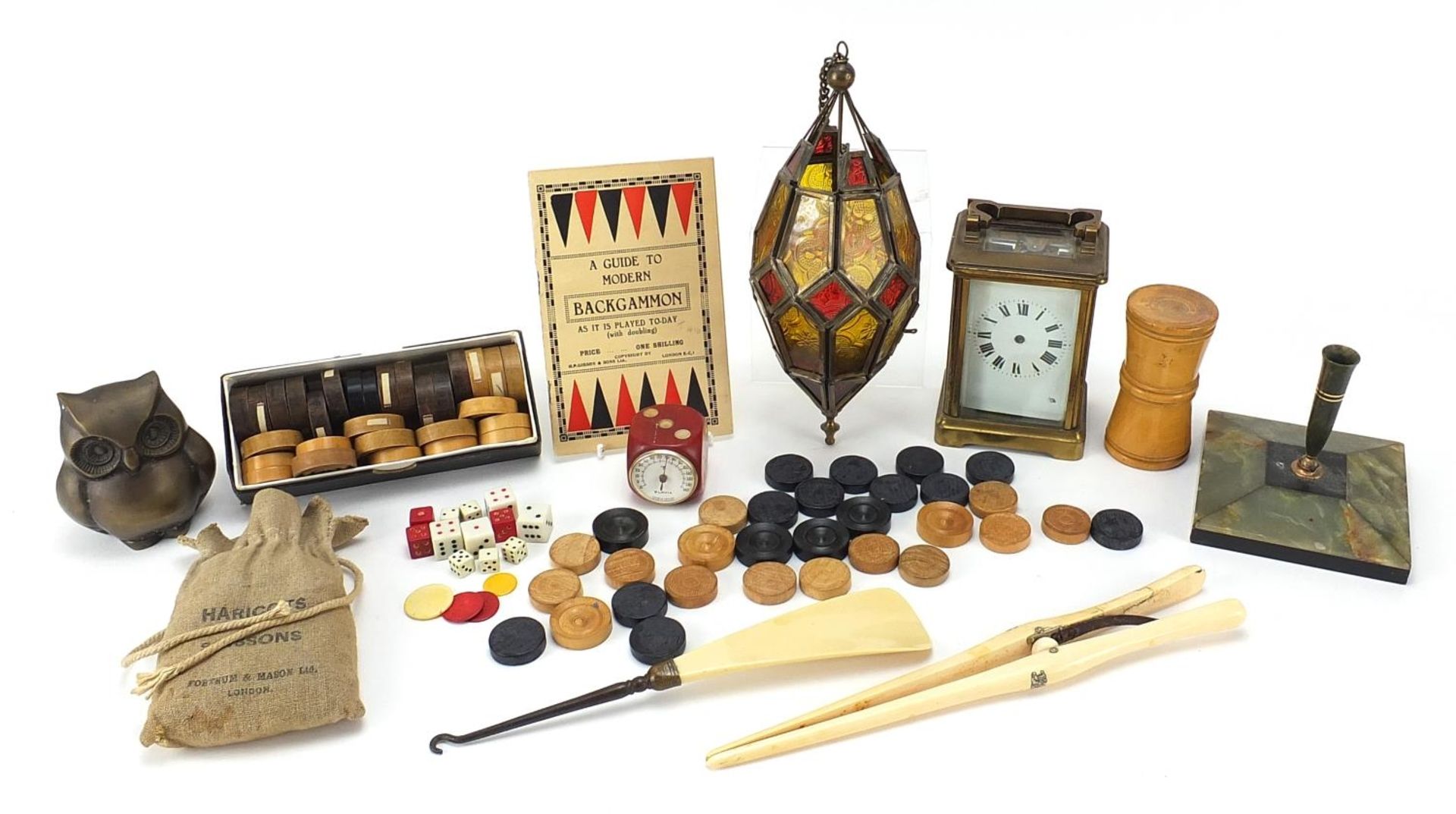 Objects including a brass cased carriage clock, turned wooden draughts pieces, Moroccan lantern