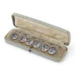 Set of six sterling silver and enamel niello work buttons housed in a fitted case, each 1.6cm in