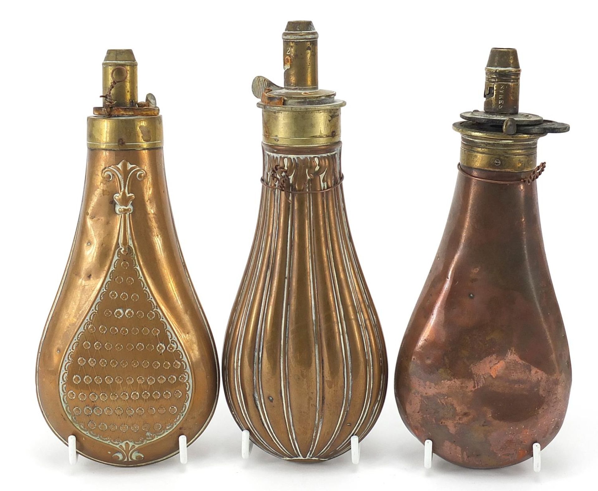 Three 19th century copper and brass powder flasks including one embossed with two hounds, - Image 2 of 4