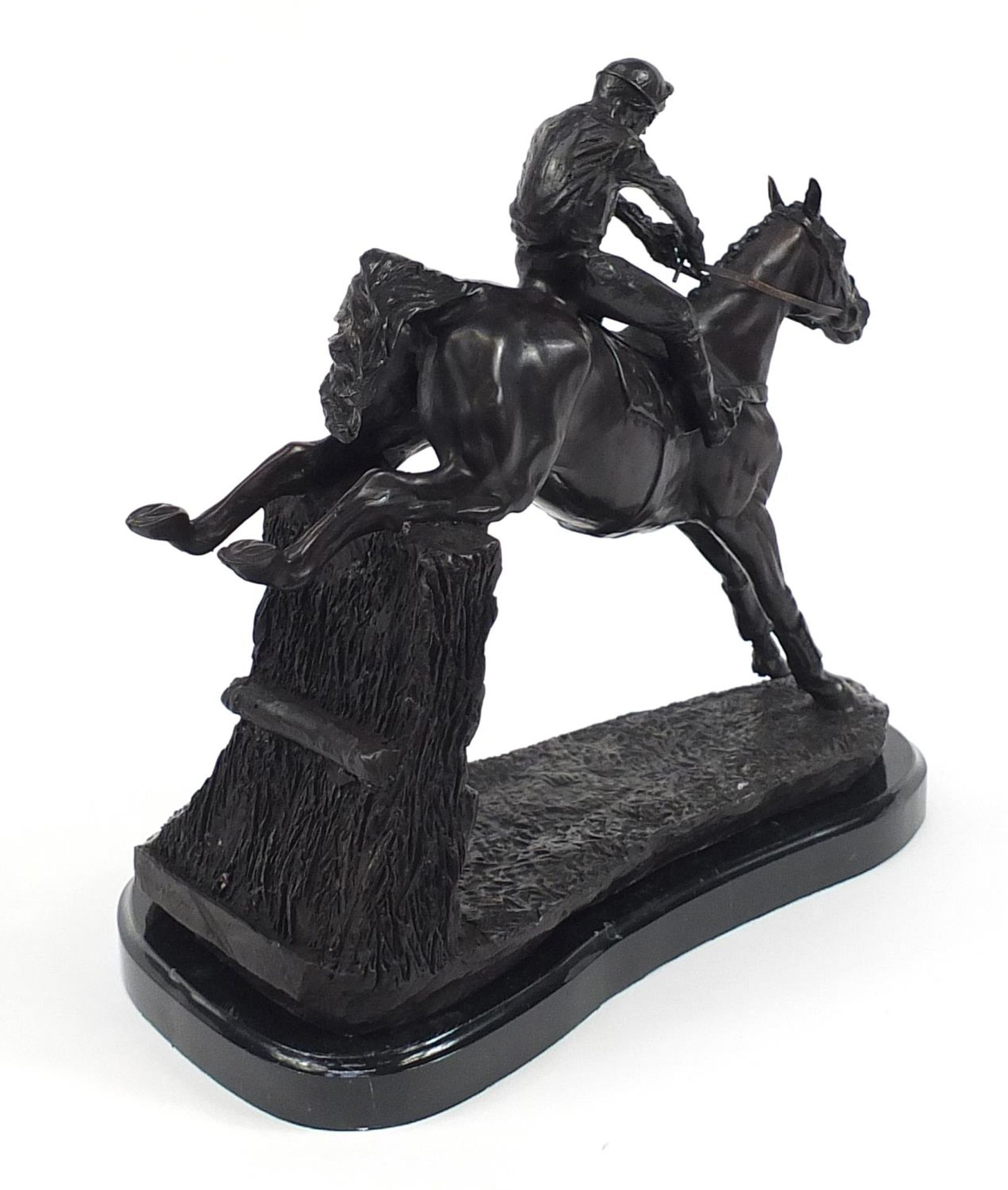 Large patinated bronze study of a jockey on horseback jumping a hurdle, 34cm in length - Image 2 of 3