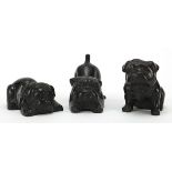 Three patinated bronze bulldogs, the largest 9.5cm in length