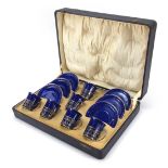 Set of six Shelley blue ground coffee cans and saucers with silver cup holders housed in a fitted