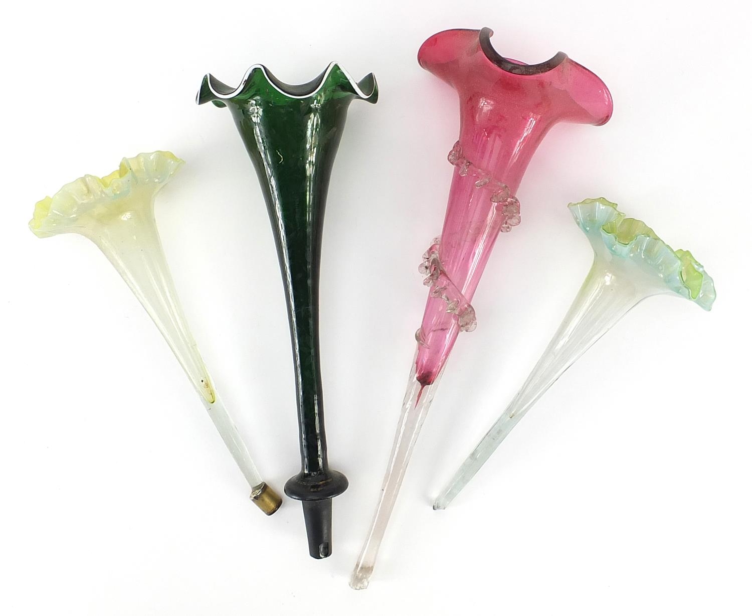 Four Victorian epergne flutes including two Vaseline examples, the largest 36cm in length