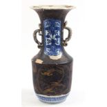 Large Japanese lacquered porcelain vase with dragon handles, gilded with birds of paradise amongst