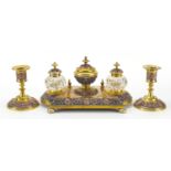 19th century continental gilt brass and copper desk set comprising a pair of candlesticks and desk