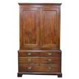 Antique mahogany linen press fitted with a pair of cupboard doors above three graduated drawers,