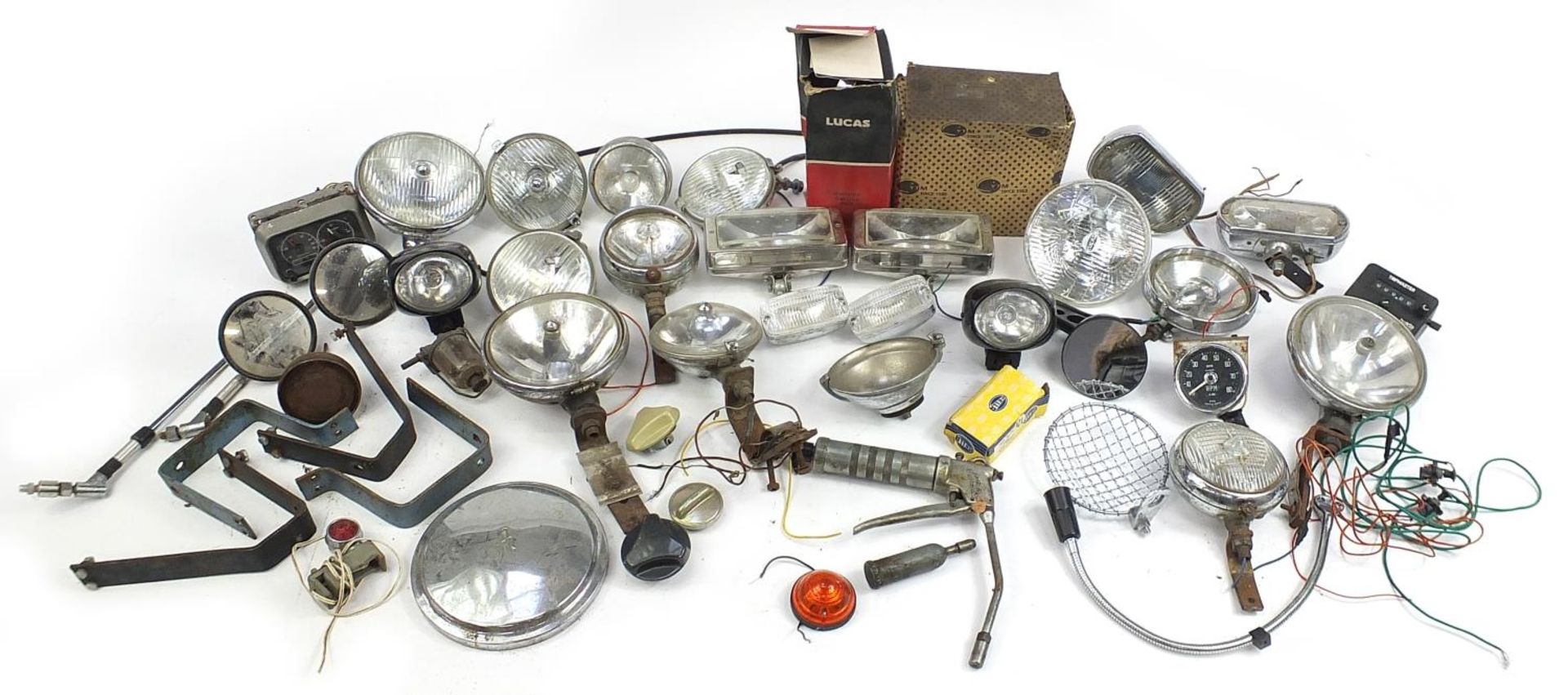 Large collection of vintage motoring interest vehicle parts including Lucas lamps and Marchal