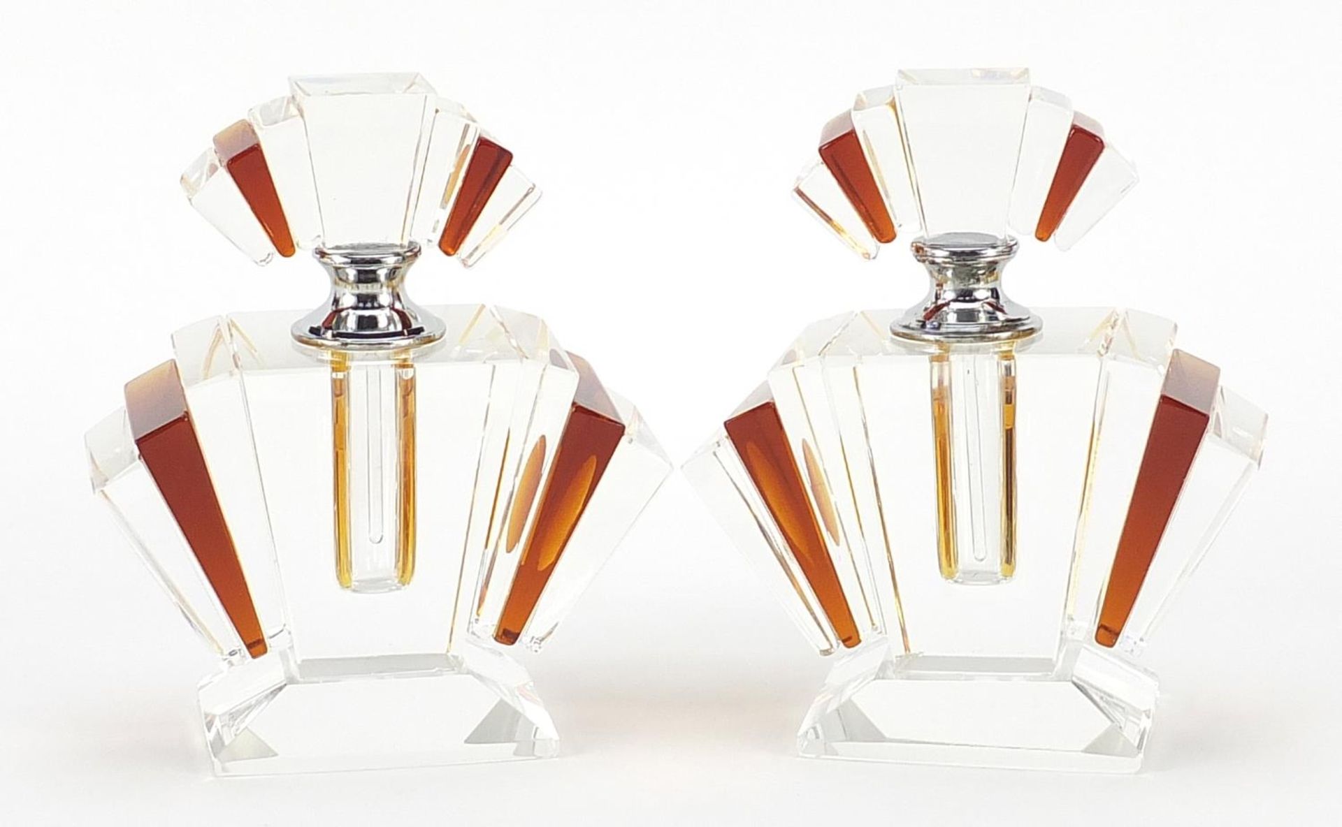 Pair of Art Deco style amber coloured and clear glass scent bottles, 12cm high