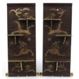 Pair of Chinese lacquered wall plaques with folding shelves, each gilded with dragons amongst