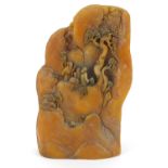 Modern Chinese amber coloured resin sculpture of figures and trees amongst mountains, 22cm high