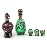 Two 1970's silver overlaid glass decanters and three glasses, the largest 22.5cm high
