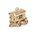 9ct gold Gypsy wagon charm opening to reveal an enamel figure, 1.5cm wide, 3.5g