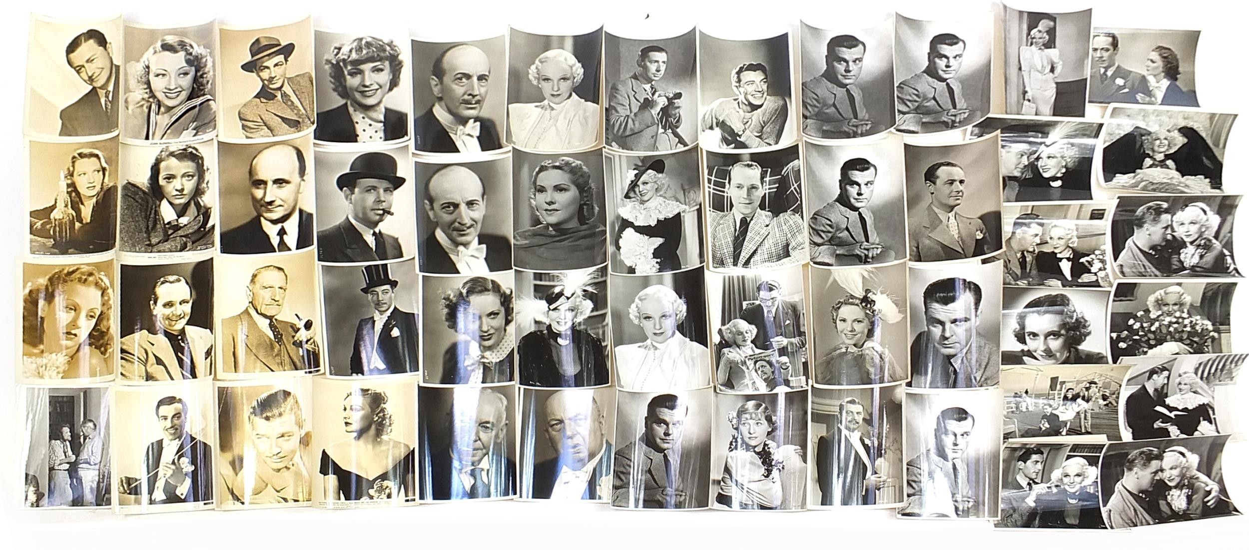 Collection of film stills and photographs of actors from the 1930's, some with stamps to the