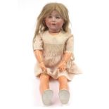 Simon & Halbig, German bisque headed doll with jointed limbs, 60cm high