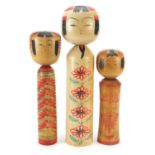 Three Japanese Kokeshi wooden dolls, the largest 40cm high