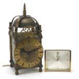 18th century style brass lantern clock and a Swiza travel alarm clock, the largest 25.5cm high