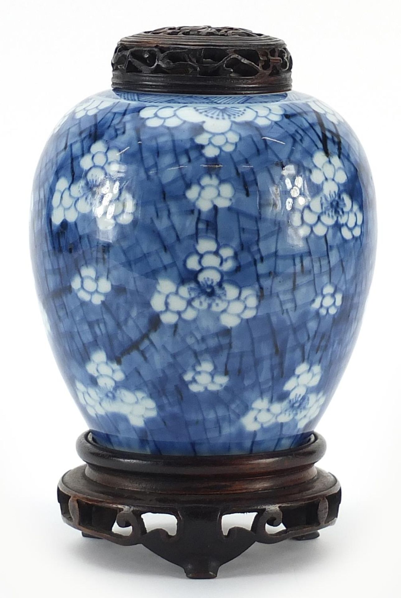 Chinese blue and white porcelain ginger jar hand painted with prunus flowers on carved hardwood - Image 2 of 3