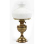 Brass oil lamp with white opaque glass shade, overall 52cm high