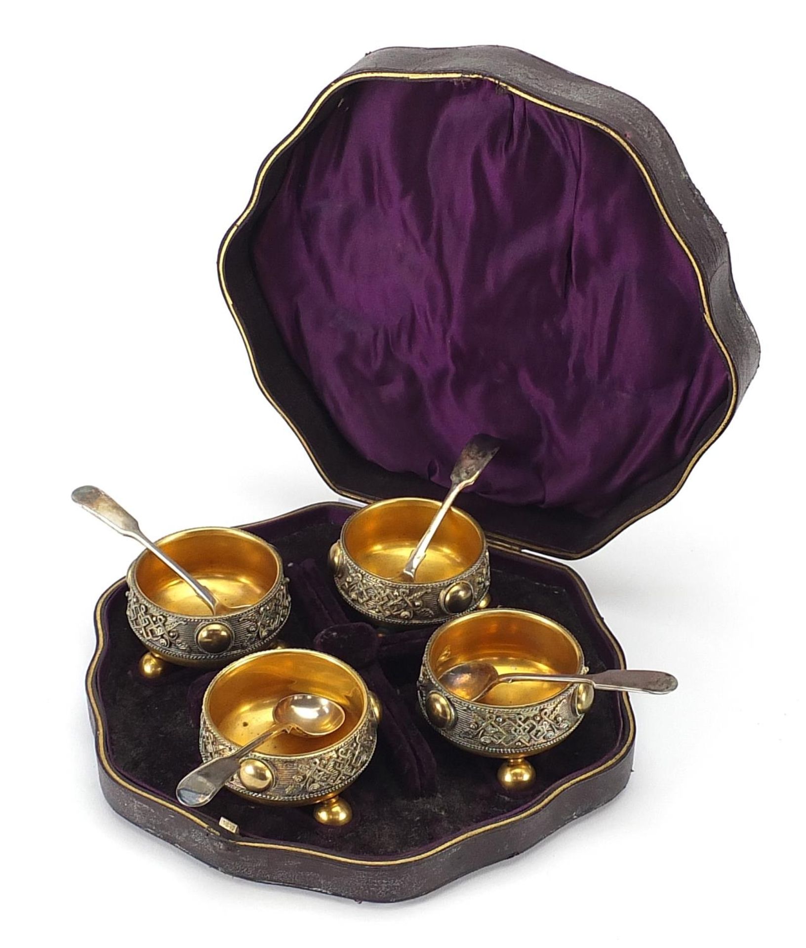 Set of four Victorian Gothic gilt metal open salts with spoons, housed in a fitted case, each 6.