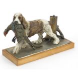 Austrian cold painted spelter table lighter in the form of a Spaniel with game, 27cm wide