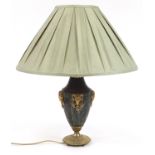 Regency style bronzed ram's head design table lamp with shade, overall 56cm high