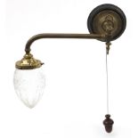 Art Nouveau brass wall light with cut glass shade and mahogany acorn design pull switch, 38cm wide