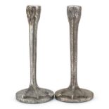 Pair of silvered metal bird feet design candlesticks, 25cm high