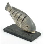 Painted carved wood piranha fish on rectangular ebonised base, 27cm wide