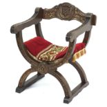 Carved oak X framed chair with shield back, 78cm high