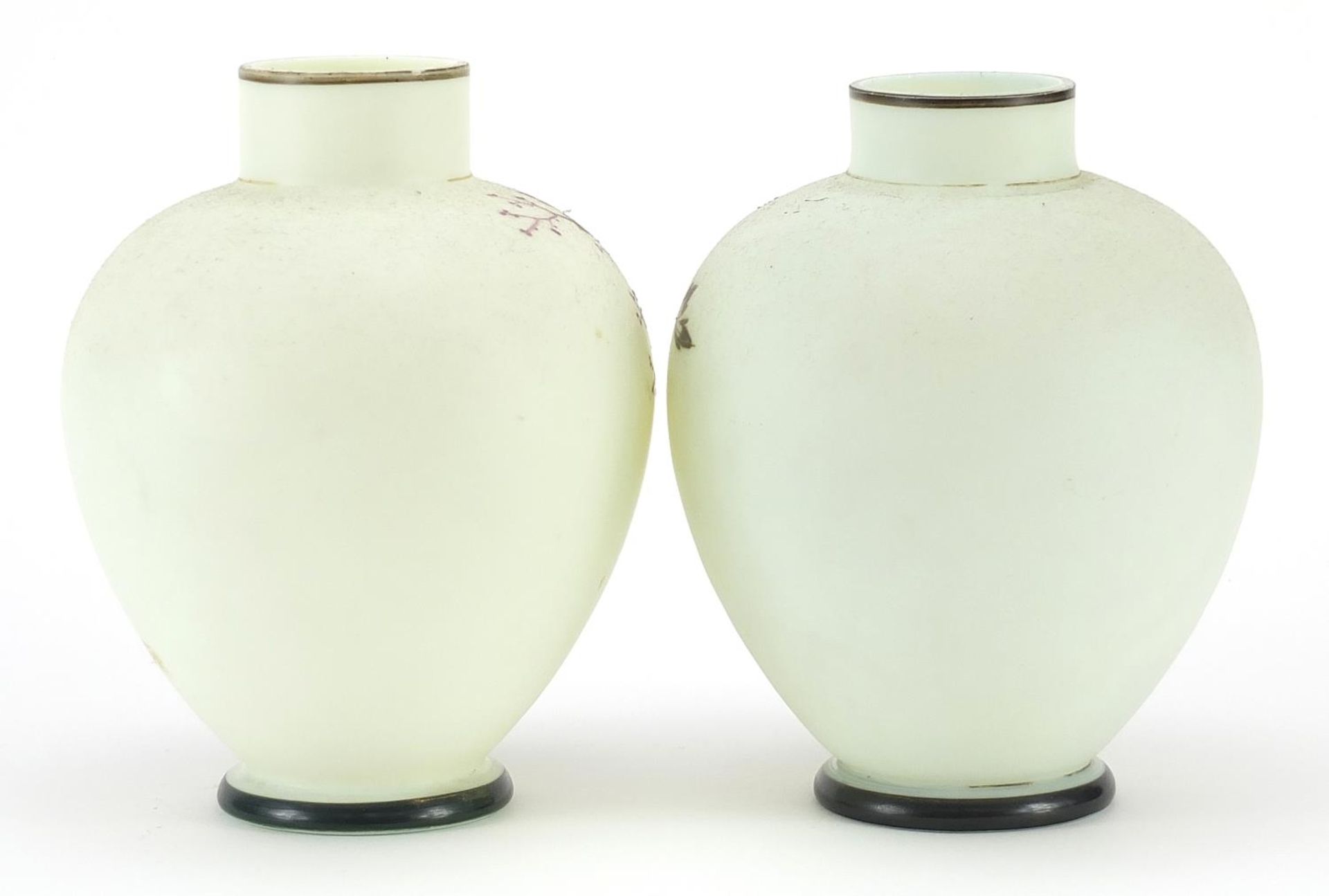 Pair of 19th century opaline glass vases hand painted with trees beside water within floral borders, - Image 2 of 3