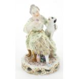 Meissen, German porcelain figure of a female with dog, 14cm high