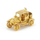 9ct gold classic car opening charm, 2.5cm in length, 7.6g