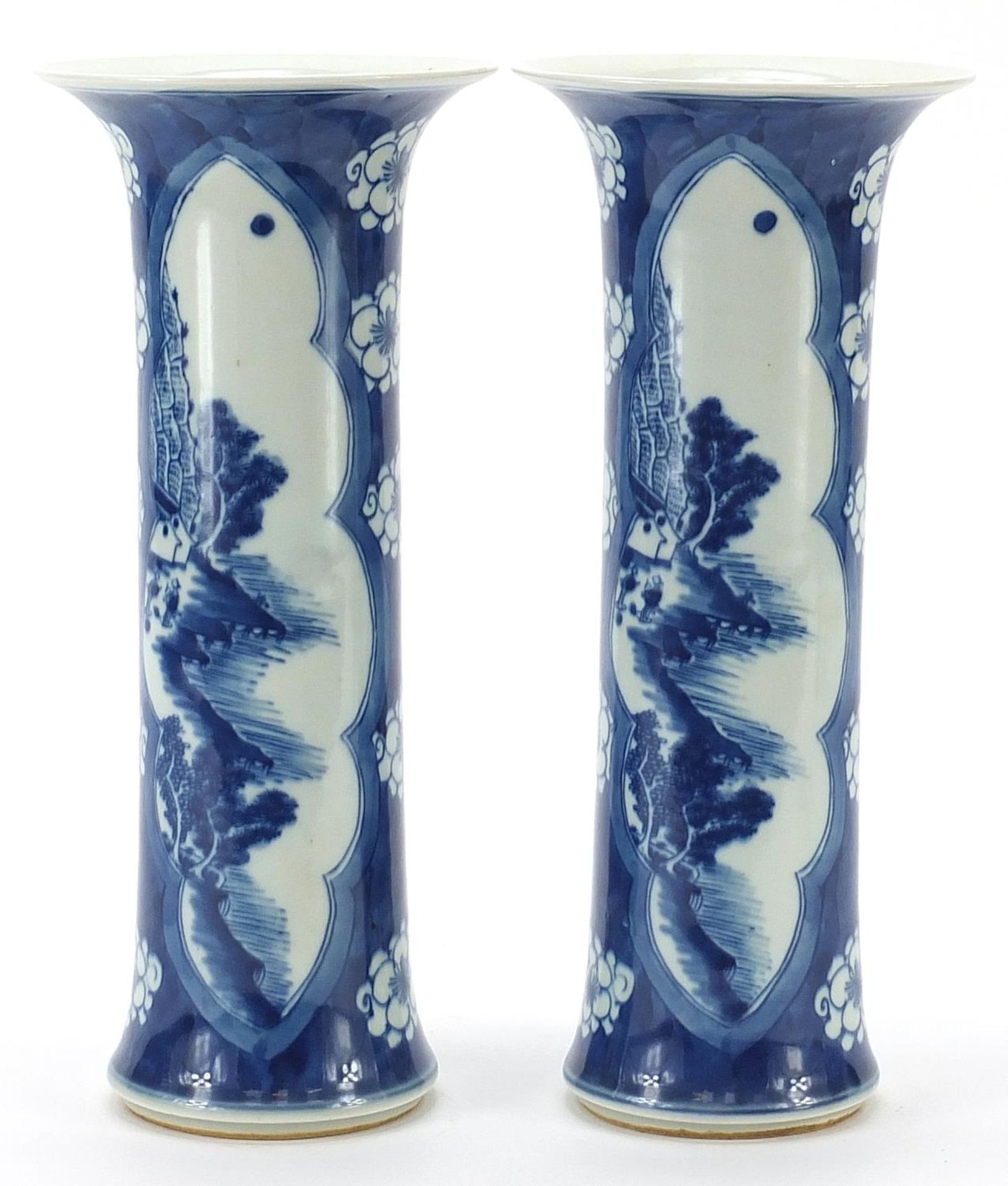 Pair of Chinese blue and white porcelain vases hand painted with panels of landscapes, blue ring