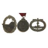 Three German military interest badges