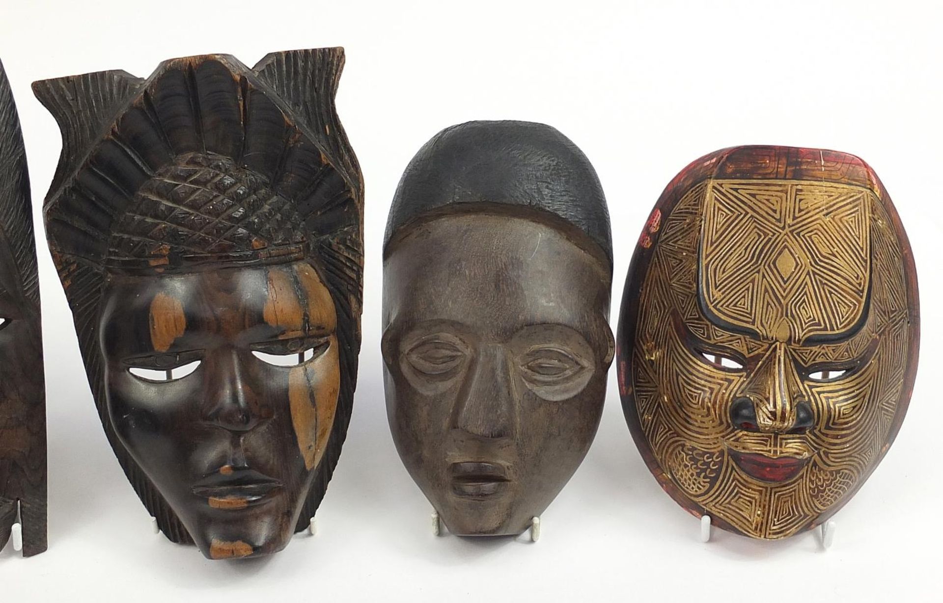 Six tribal interest carved wood face masks, the largest 31cm high - Image 3 of 4