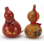 Two Japanese sake gourds including a lacquered example, the largest 28cm high