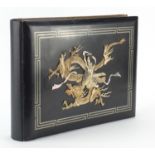 Oriental black lacquered photograph album with bone and mother of pearl inlay containing black and