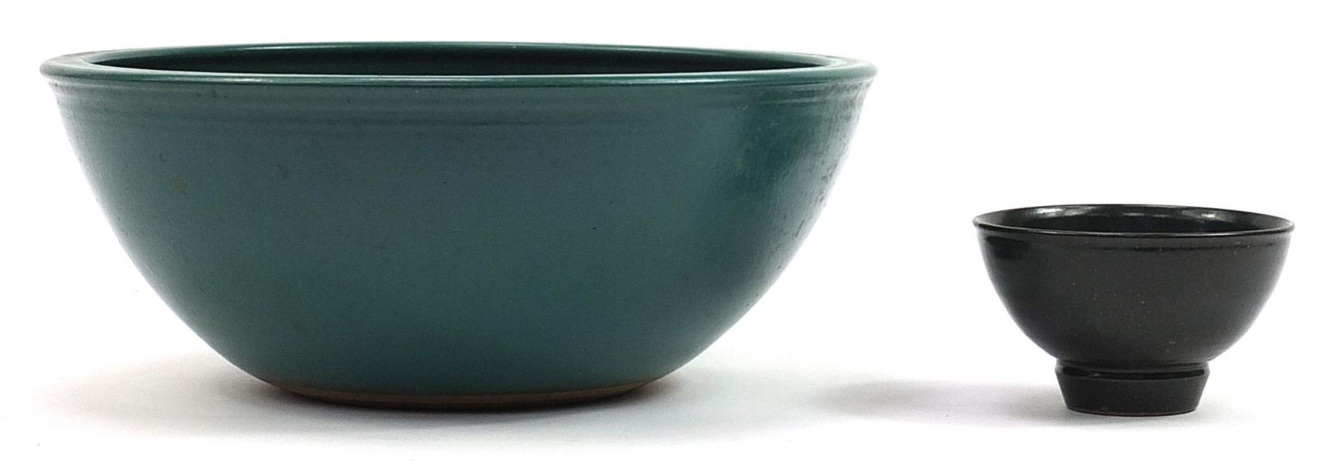 Two David Lloyd Jones studio pottery bowls having green glazes, the largest 39.5cm in diameter