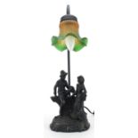 Bronzed figural table lamp with frilled glass shade, 46.5cm high