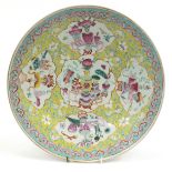 Chinese porcelain charger hand painted in the famille rose palette with lucky objects and flowers.