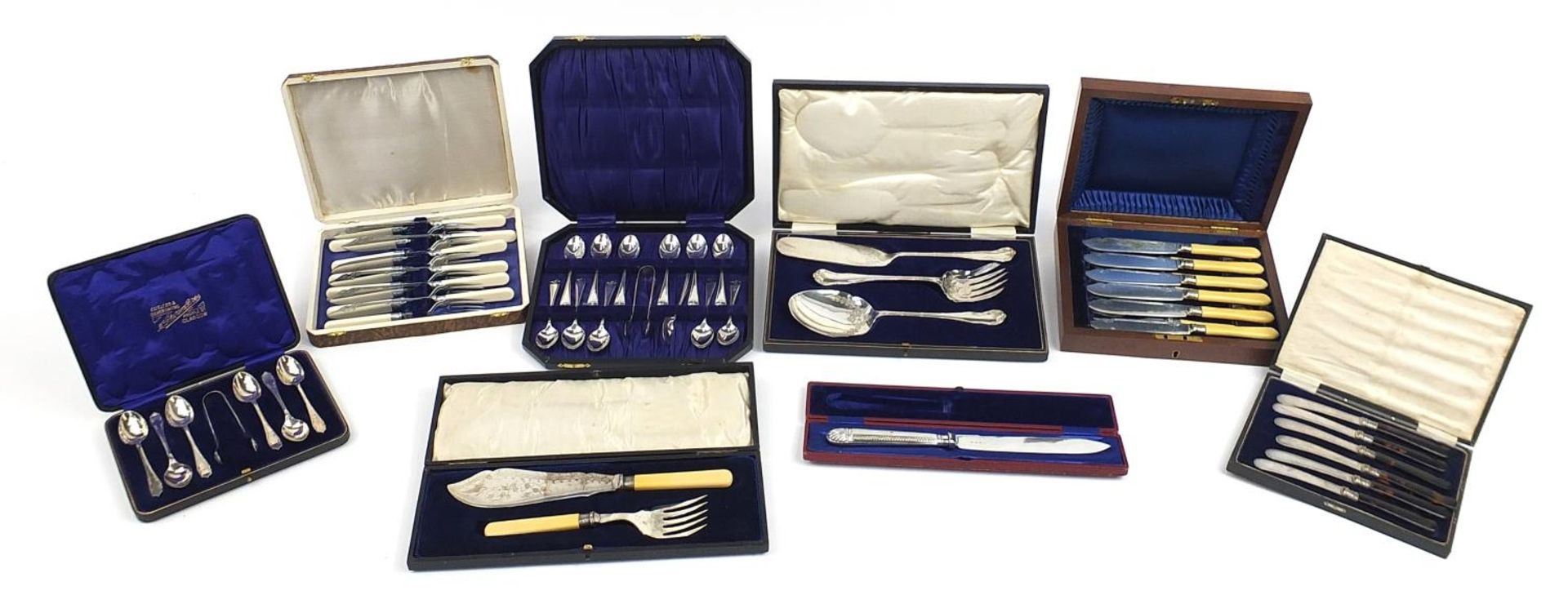 Silver plated cutlery housed in fitted cases including set of six fish knives and forks with ivorine